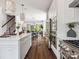 Spacious kitchen with a center island, stainless steel appliances, and an open view to the dining and living areas at 411 Old Town Village Rd, Waxhaw, NC 28173