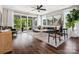 Spacious living room with access to balcony, hardwood floors, and neutral decor at 411 Old Town Village Rd, Waxhaw, NC 28173