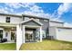 Townhome's back exterior showing covered patio, fenced yard, and outdoor seating area at 4248 Black Ct # 232, Harrisburg, NC 28075