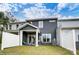 View of the back of the house showing the fenced yard and patio with sliding glass doors at 4248 Black Ct # 232, Harrisburg, NC 28075