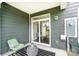 Covered back patio with sliding doors, stylish chairs, and outdoor decor at 4248 Black Ct # 232, Harrisburg, NC 28075