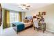 Stylish bedroom with a ceiling fan, great natural light, a desk, and decorative decor at 4248 Black Ct # 232, Harrisburg, NC 28075