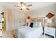 Bedroom with carpet, a ceiling fan, natural light, a bamboo headboard, and decor at 4248 Black Ct # 232, Harrisburg, NC 28075