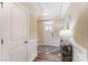 Bright foyer with wainscoting, a decorative mirror, and stylish flooring at 4248 Black Ct # 232, Harrisburg, NC 28075
