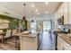 Modern kitchen with stainless steel appliances, a large island, and an open view to the living area at 4248 Black Ct # 232, Harrisburg, NC 28075