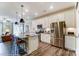 Well-equipped kitchen with stainless steel appliances, an island with seating, and white cabinetry at 4248 Black Ct # 232, Harrisburg, NC 28075