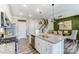 Bright kitchen featuring a large center island with granite countertops, stainless steel appliances, and a dining area at 4248 Black Ct # 232, Harrisburg, NC 28075