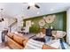 Bright living room with stylish decor, a textured accent wall, and modern furnishings at 4248 Black Ct # 232, Harrisburg, NC 28075