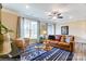 Cozy living room with natural light, comfortable furnishings, and a patterned rug at 4248 Black Ct # 232, Harrisburg, NC 28075