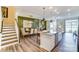 Open-concept living space with a modern kitchen, dining area, and staircase at 4248 Black Ct # 232, Harrisburg, NC 28075