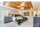Stunning main bedroom with wood tray ceiling, ceiling fan, and sophisticated decor and natural light at 4248 Black Ct # 232, Harrisburg, NC 28075