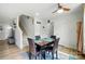 The open-concept dining area features a staircase, wood floors and neutral paint tones at 4439 Wild Ridge Dr, Charlotte, NC 28215