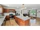 Modern kitchen featuring a center island, stainless appliances, and open access to living area at 4439 Wild Ridge Dr, Charlotte, NC 28215