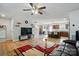Open-concept floorplan showing living room, kitchen with island, and dining area at 4439 Wild Ridge Dr, Charlotte, NC 28215