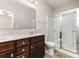 Bathroom featuring a glass shower enclosure, modern vanity, and neutral tones at 5053 Arbordale Way, Mount Holly, NC 28120