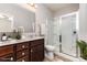 Bathroom featuring a glass shower enclosure, modern vanity, and neutral tones at 5053 Arbordale Way, Mount Holly, NC 28120