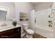 Bathroom featuring modern fixtures, a vanity with stone countertop, and a shower-tub combination at 5053 Arbordale Way, Mount Holly, NC 28120