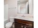 Bright bathroom featuring a shower-tub combination, framed mirror, and sleek vanity with marble countertop at 5053 Arbordale Way, Mount Holly, NC 28120