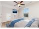Comfortable staged bedroom with blue accents, and a view to the outdoors at 5053 Arbordale Way, Mount Holly, NC 28120