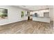 Open concept kitchen featuring an island, wood floors, and stainless appliances at 5053 Arbordale Way, Mount Holly, NC 28120