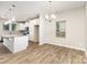 Bright kitchen featuring white cabinetry, granite countertops, and stainless appliances at 5053 Arbordale Way, Mount Holly, NC 28120