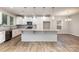 Kitchen featuring stainless steel appliances, white cabinetry and granite countertops at 5053 Arbordale Way, Mount Holly, NC 28120