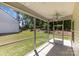 Relaxing screened patio featuring a ceiling fan perfect for enjoying the outdoors at 5053 Arbordale Way, Mount Holly, NC 28120