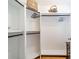 Spacious walk-in closet with multiple levels of shelving and hanging rods, offering ample storage solutions at 5522 Sharon Rd, Charlotte, NC 28210