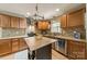 Beautiful kitchen with wood cabinets, stainless steel appliances, and tile backsplash at 5522 Sharon Rd, Charlotte, NC 28210