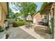 Outdoor patio with a grill and dining area surrounded by well-maintained landscaping at 5522 Sharon Rd, Charlotte, NC 28210
