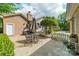 Patio with outdoor table, grill, and landscaped yard at 5522 Sharon Rd, Charlotte, NC 28210