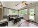 Cozy sunroom featuring neutral decor, ceiling fan, and lots of natural light at 5522 Sharon Rd, Charlotte, NC 28210