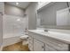 Well-lit bathroom featuring a clean vanity with modern fixtures and a white shower-tub combination at 5705 White St, Fort Lawn, SC 29714