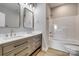 Bright bathroom featuring a double vanity with modern fixtures and a clean, white shower-tub combination at 5705 White St, Fort Lawn, SC 29714