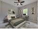 Comfortable bedroom with a ceiling fan, neutral walls, and a dedicated workspace for added functionality at 5705 White St, Fort Lawn, SC 29714