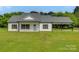 Charming single-story home with white siding, a well-manicured lawn, and a convenient attached carport at 5705 White St, Fort Lawn, SC 29714