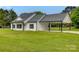 Charming home with gray roof, white siding, black trim, and a convenient carport at 5705 White St, Fort Lawn, SC 29714