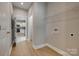 Neutral laundry room with wire rack shelving and convenient access to the kitchen area at 5705 White St, Fort Lawn, SC 29714