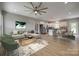 Open-concept living space featuring a modern kitchen, a dining area, and a comfortably furnished living room at 5705 White St, Fort Lawn, SC 29714