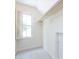 Cozy attic space featuring a window with shutters and ample storage space with a closet rod at 6007 Patrick Pl, Charlotte, NC 28210