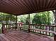 A covered back deck with built in seating provides a comfortable outdoor living area at 6007 Patrick Pl, Charlotte, NC 28210