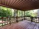 A covered back deck offers ample space for outdoor relaxation and entertaining at 6007 Patrick Pl, Charlotte, NC 28210