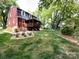 A spacious backyard with a deck and lush green lawn offers ample outdoor living space at 6007 Patrick Pl, Charlotte, NC 28210