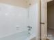 Bright bathroom featuring a shower head and a full bathtub at 6007 Patrick Pl, Charlotte, NC 28210