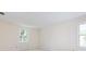 Bright bedroom featuring two windows and soft carpet at 6007 Patrick Pl, Charlotte, NC 28210