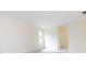 Spacious bedroom with neutral walls, carpet flooring and a large window at 6007 Patrick Pl, Charlotte, NC 28210