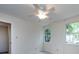 Cozy bedroom with a ceiling fan and two windows providing natural light at 6007 Patrick Pl, Charlotte, NC 28210