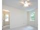 Bright bedroom featuring a ceiling fan and abundant natural light from the windows at 6007 Patrick Pl, Charlotte, NC 28210