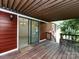 Exterior of deck with stained wood and sliding glass doors leading to dining room at 6007 Patrick Pl, Charlotte, NC 28210