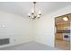 Elegant dining room featuring a chandelier and an open doorway to the kitchen at 6007 Patrick Pl, Charlotte, NC 28210